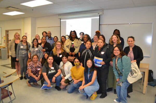 A group picture of Greater Lawndale community members, UIC stakeholders, and GLHW project members that attended the share back event.